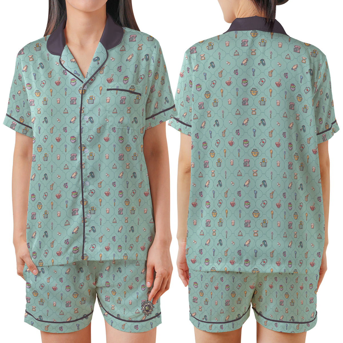 A woman modeling a two-piece pajama set shown from the front and back. The set consists of a short-sleeve button-up top and matching shorts in a light sage green color with a dense multicolor pattern of small icons, featuring dark purple trim and collar.