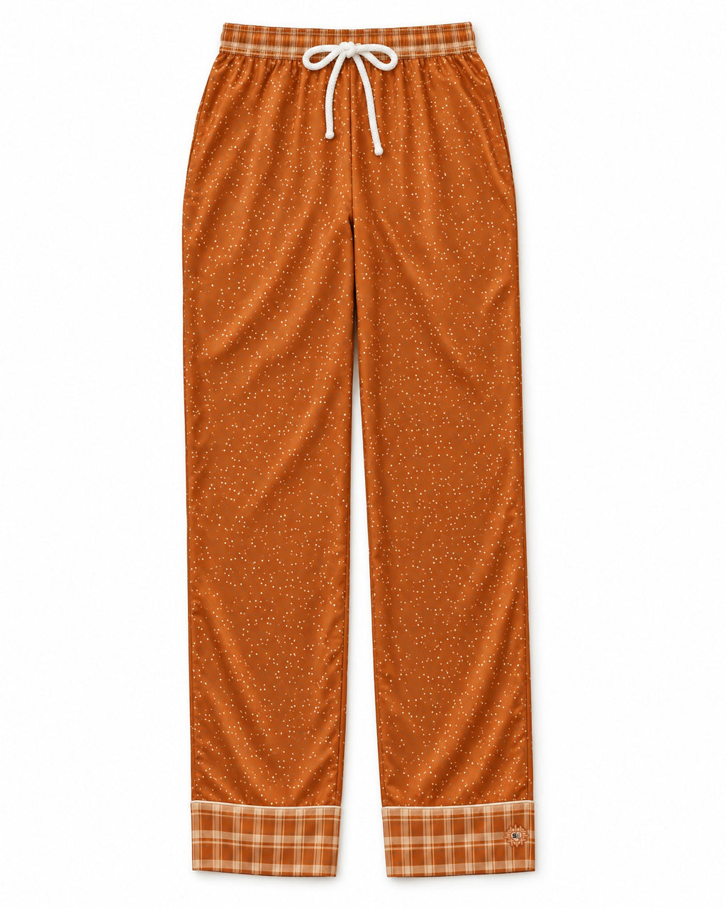 Burnt Orange & Cream satin pajama pants laid flat on white: warm burnt-orange satin with tiny cream dots, plaid waistband and cuffs, white drawstring bow