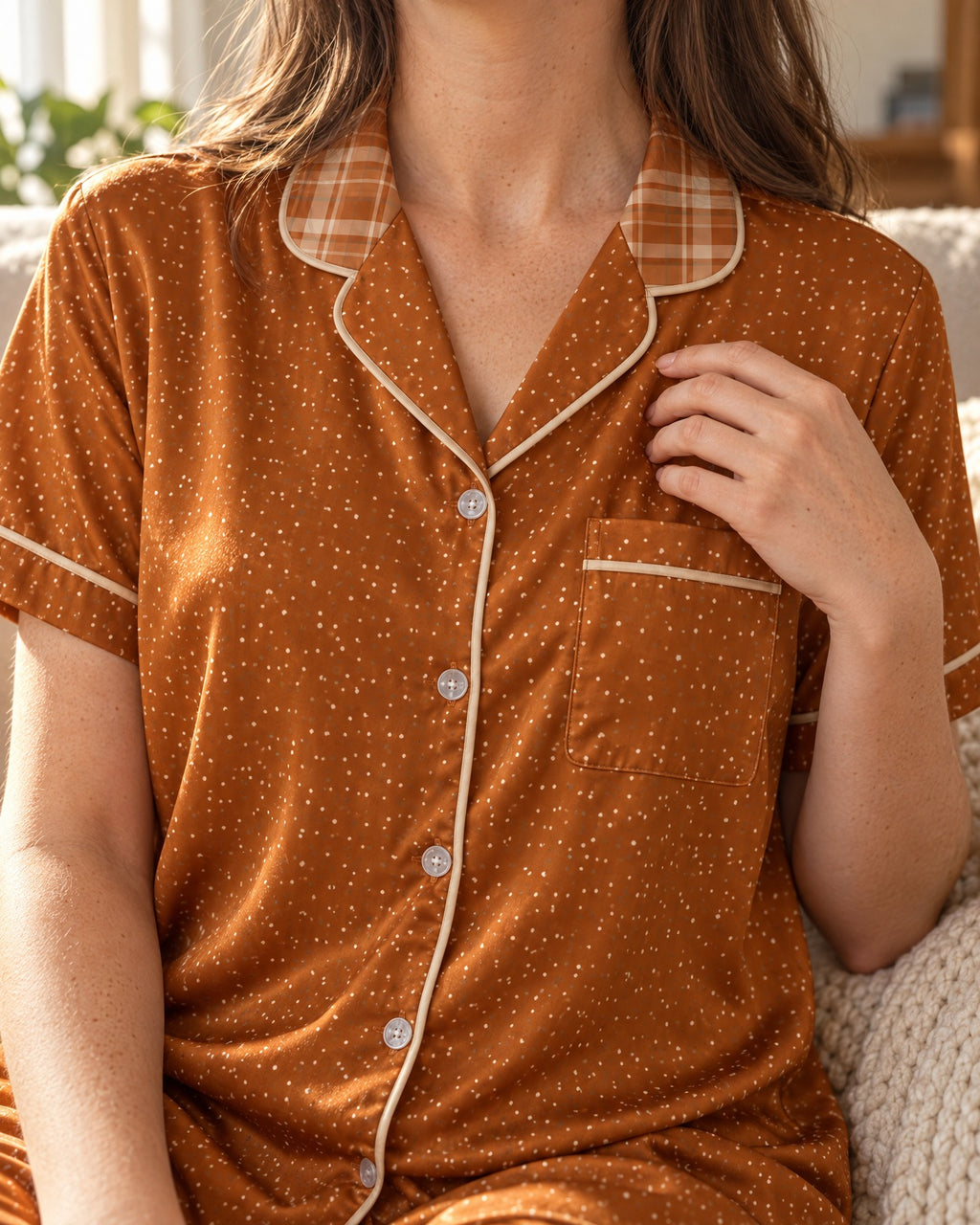 Close-up of the Burnt Orange & Cream pajama top: burnt-orange and cream plaid collar, dotted lapels, chest pocket and cream-tan piping