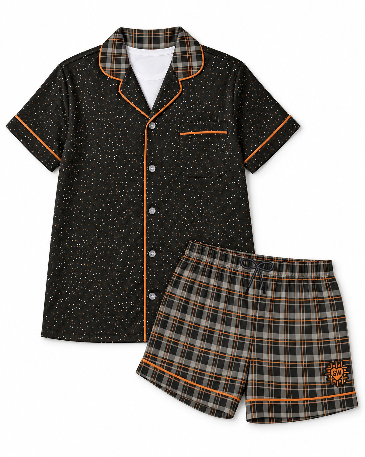 Orange & Licorice satin pajama set laid flat on white: black top, black and warm-gray plaid with thin orange lines shorts, black drawstring