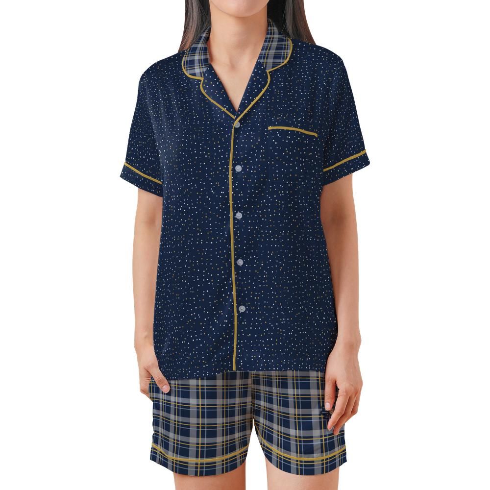 Front view of the Navy & Brass satin pajama set on a model against a white background
