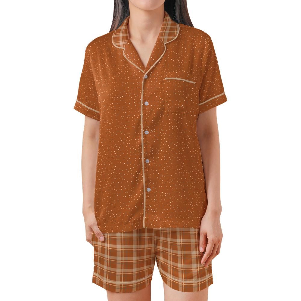 Front view of the Burnt Orange & Cream satin pajama set on a model against a white background