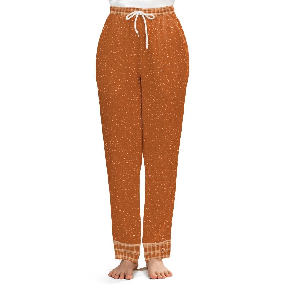 Front view of the Burnt Orange & Cream satin pajama pants on a model against a white background