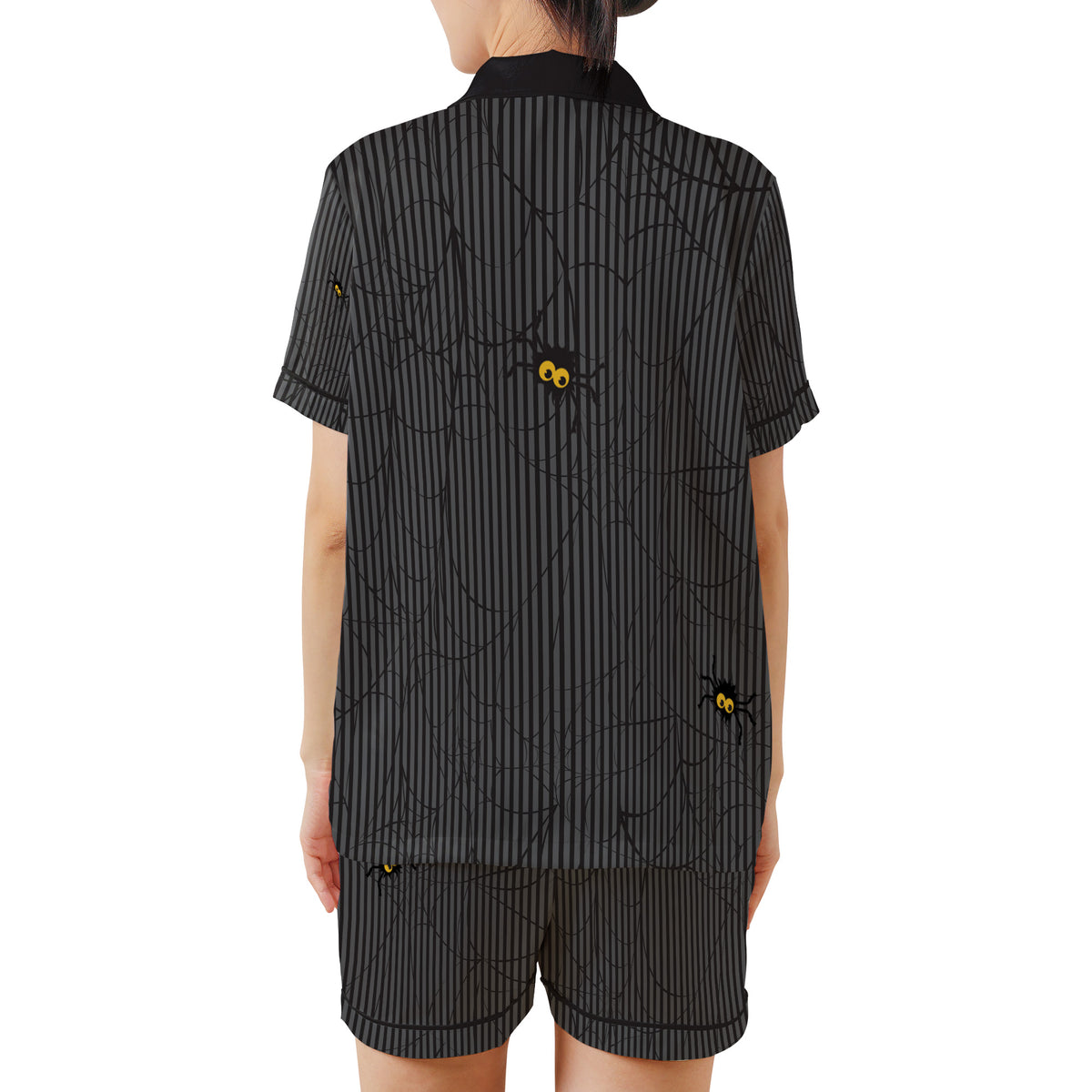 A model shown from the back wearing a black and gray vertically striped short-sleeve shirt and matching shorts with a spider and web pattern, set against a plain white background.